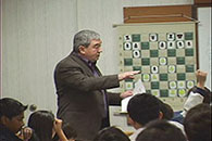 Roman Pelts leads a lecture at Chess Academy of Canada