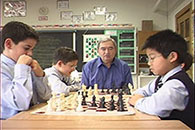 Roman Pelts observing students play