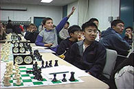Students answering questions in a chess workshop